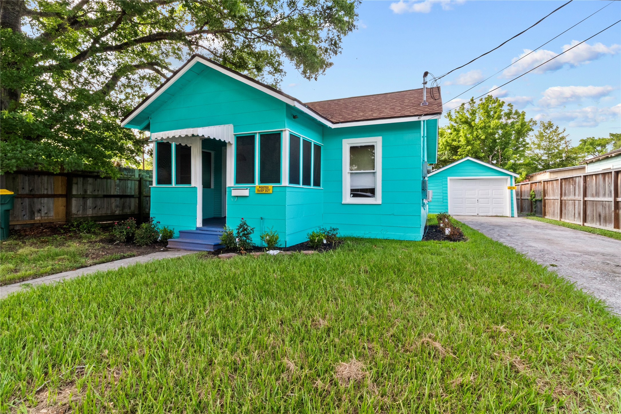 706 East Hunnicutt Street Baytown, TX 77520 - Photo 2 of 12 a front view of a house with a yard and porch