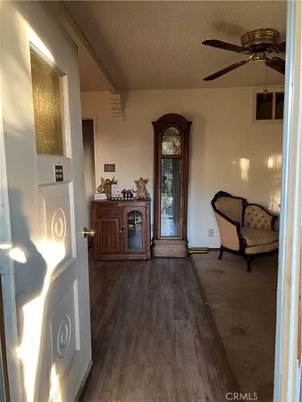 a view of living room with furniture and wooden floor