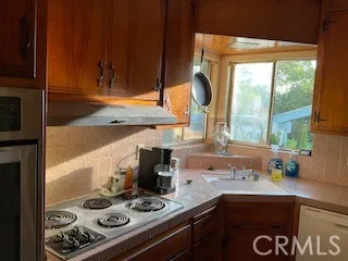 a kitchen with a stove and a sink