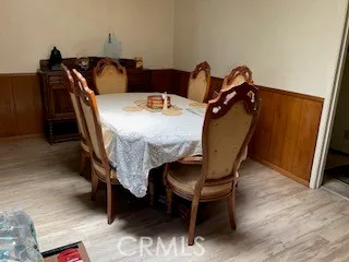 a view of a workspace with furniture and wooden floor
