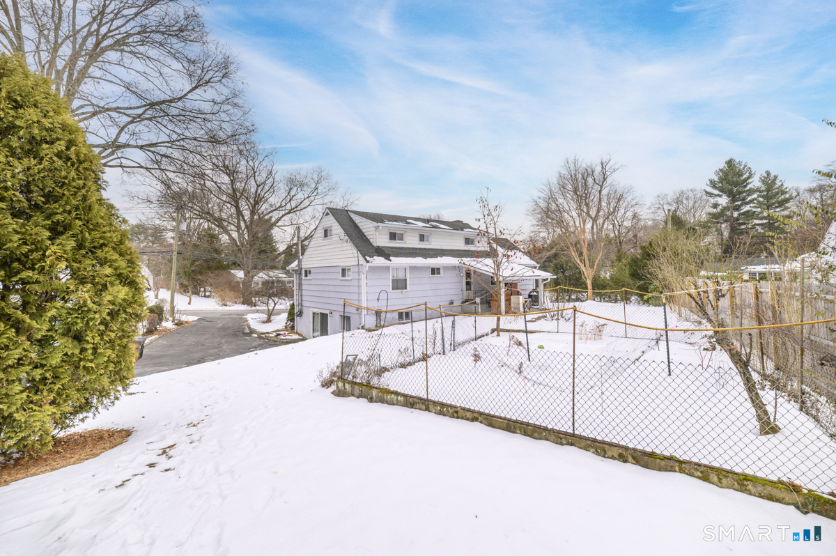 63 Alpine Street Stamford, CT 06905 - Photo 20 of 22 a view of a swimming pool with a yard