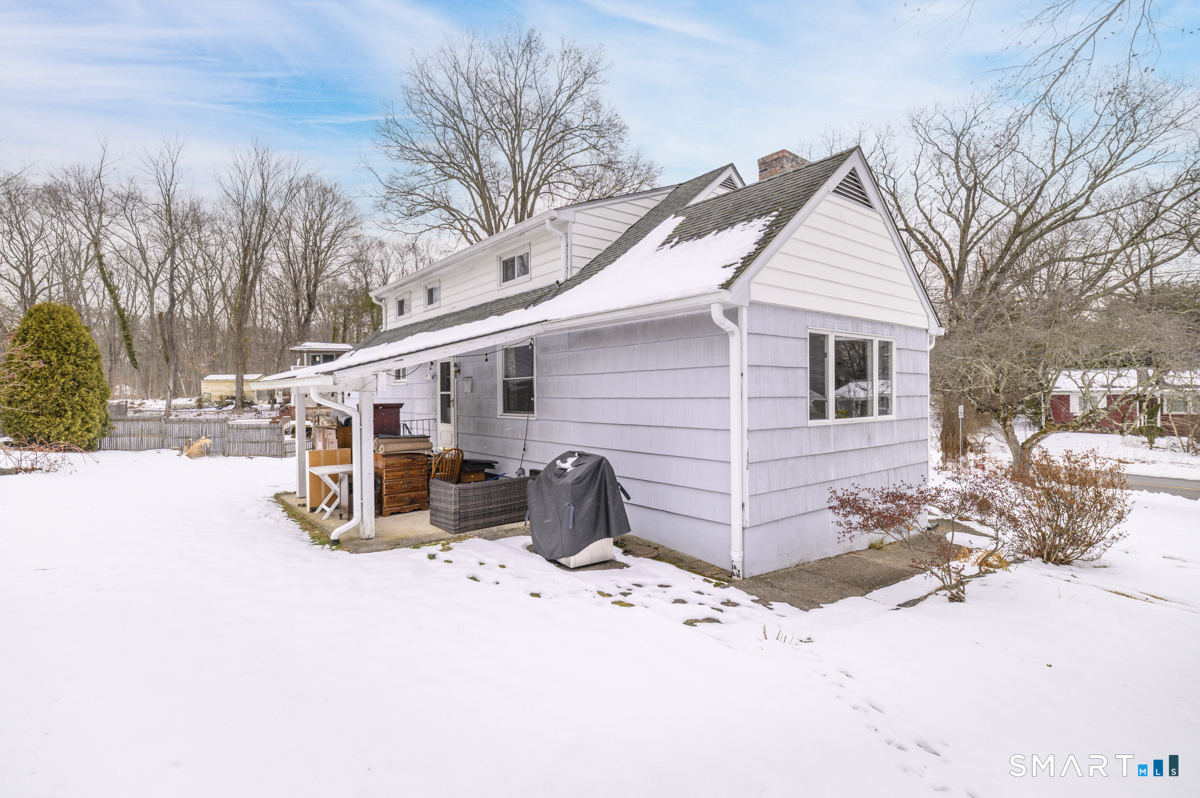 63 Alpine Street Stamford, CT 06905 - Photo 22 of 22 a view of a white house covered in snow