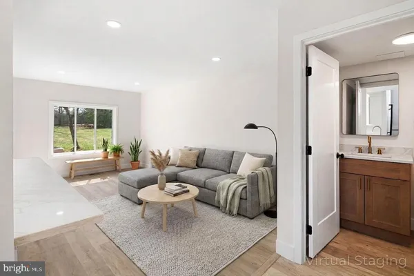 a view of a kitchen with a sink and a refrigerator