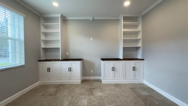 a view of cabinets and window