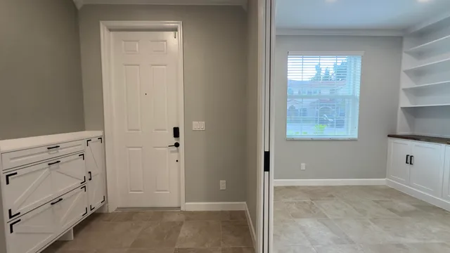 a view of entryway with wooden floor and stairs