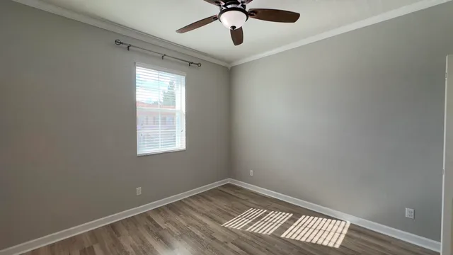 a bathroom with a bathtub shower sink vanity and toilet