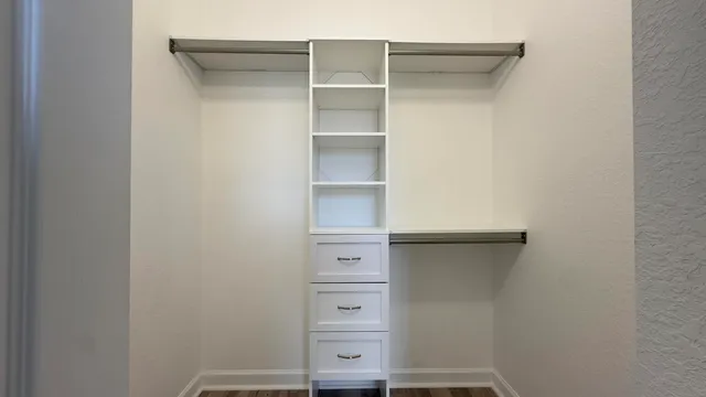 a view of a house with wooden fence