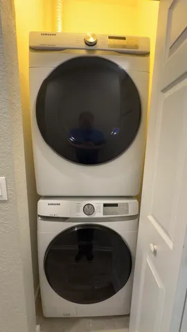 a view of a swimming pool with a chair and palm trees