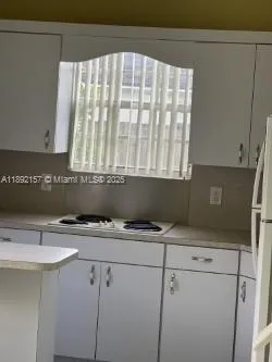 a kitchen with a sink and a window