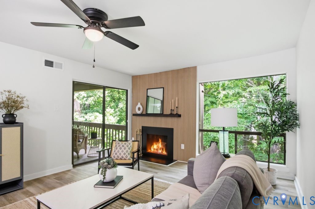 10270 Iron Mill Road Richmond, VA 23235 - Photo 15 of 29 Living area featuring a modern fireplace with a wo