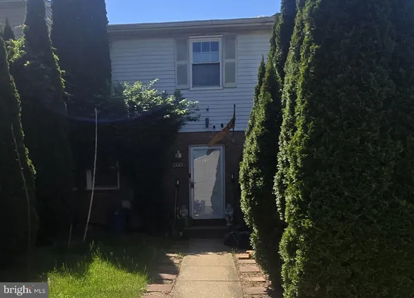 a house with trees in front of it