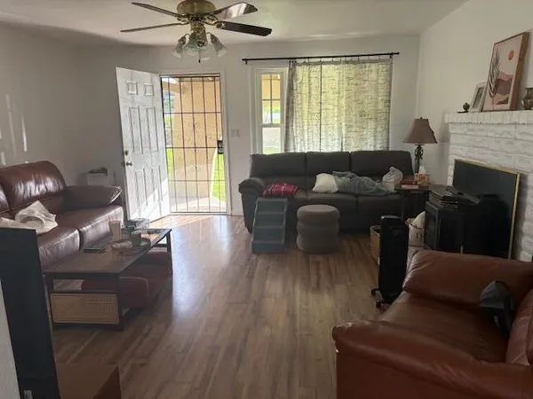 a living room with furniture and a fireplace