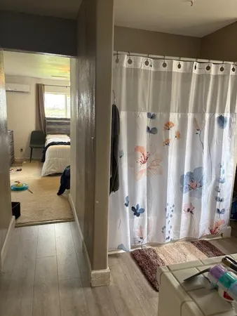 a bedroom with a bed and a walk in closet