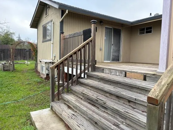 a view of a house with a small yard