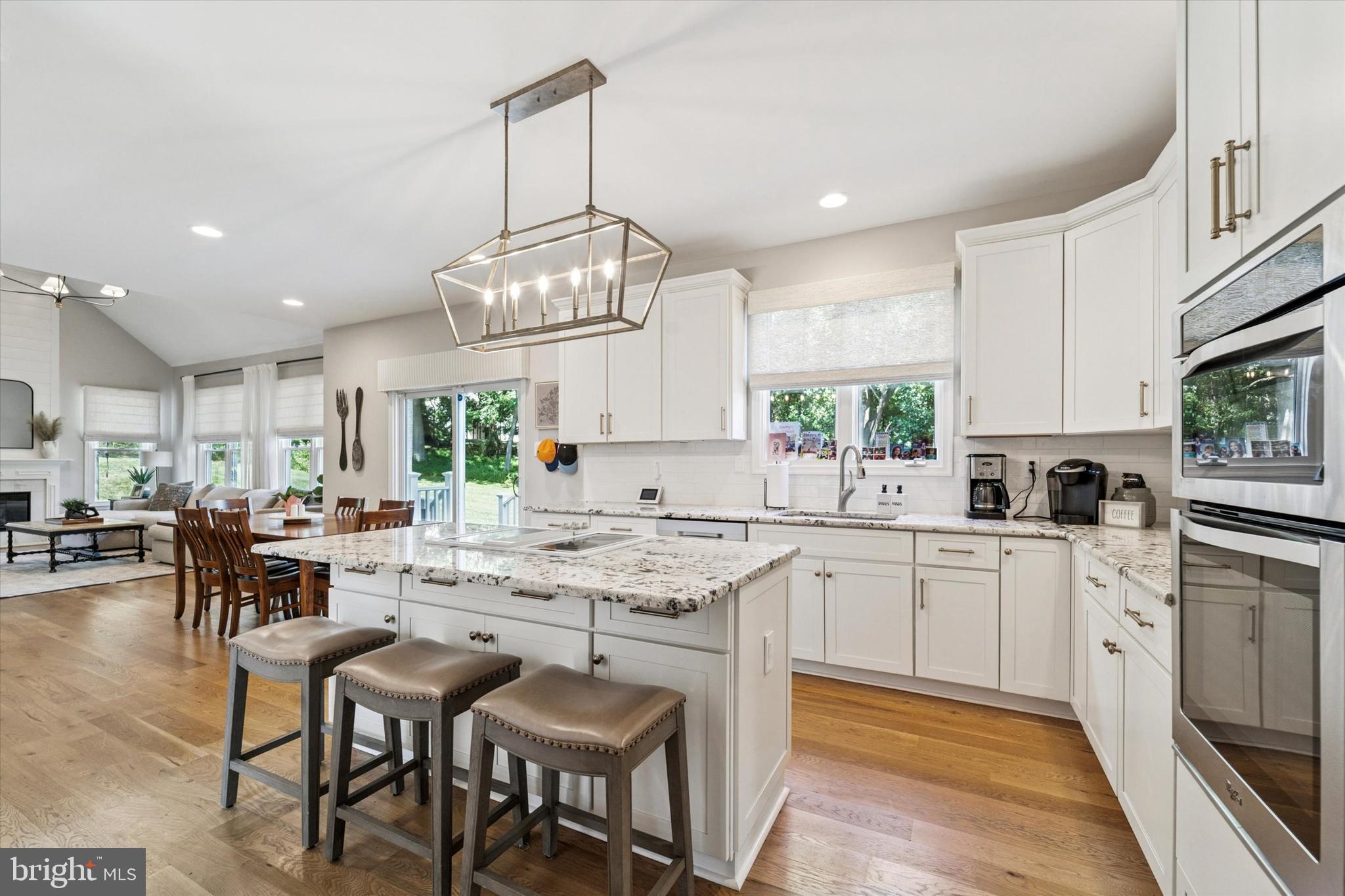 5 Stoney End Road Broomall, PA 19008 - Photo 14 of 48 a kitchen with a dining table chairs stainless steel appliances and cabinets