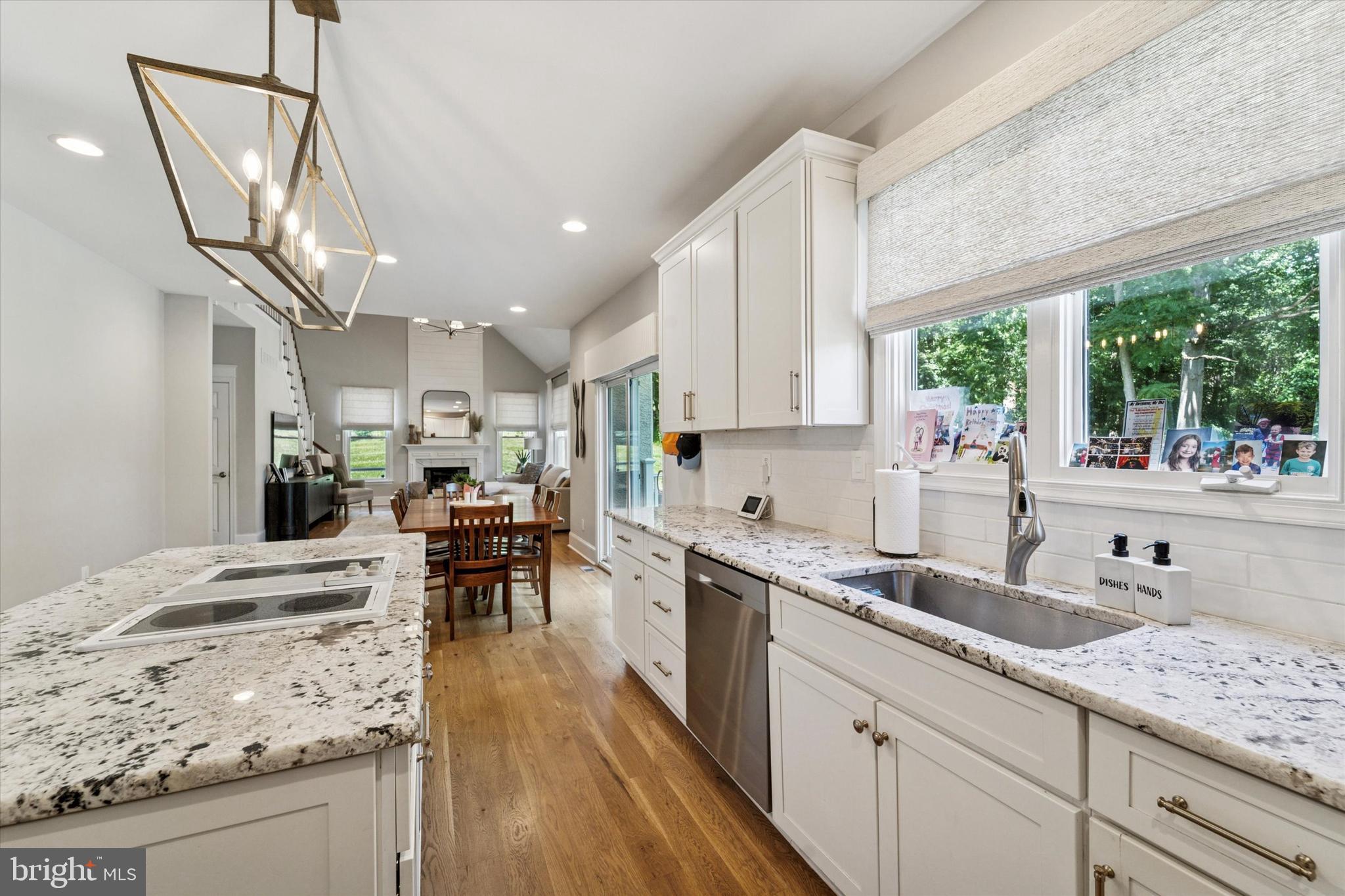 5 Stoney End Road Broomall, PA 19008 - Photo 15 of 48 a kitchen with stainless steel appliances granite countertop a sink stove and cabinets