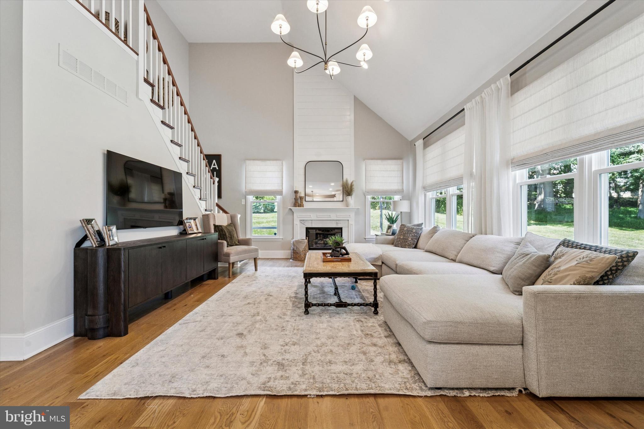 5 Stoney End Road Broomall, PA 19008 - Photo 20 of 48 a living room with furniture a flat screen tv and a fireplace