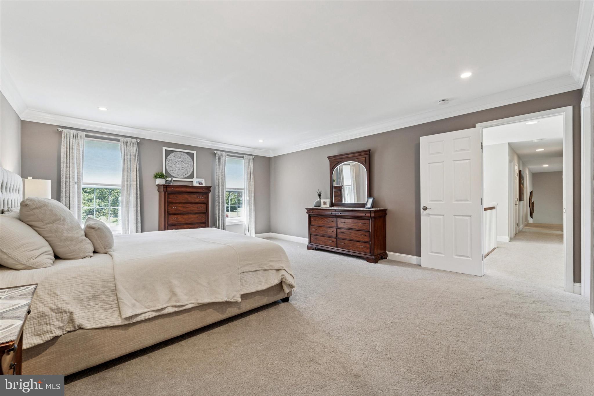 5 Stoney End Road Broomall, PA 19008 - Photo 26 of 48 a spacious bedroom with a bed and a couch