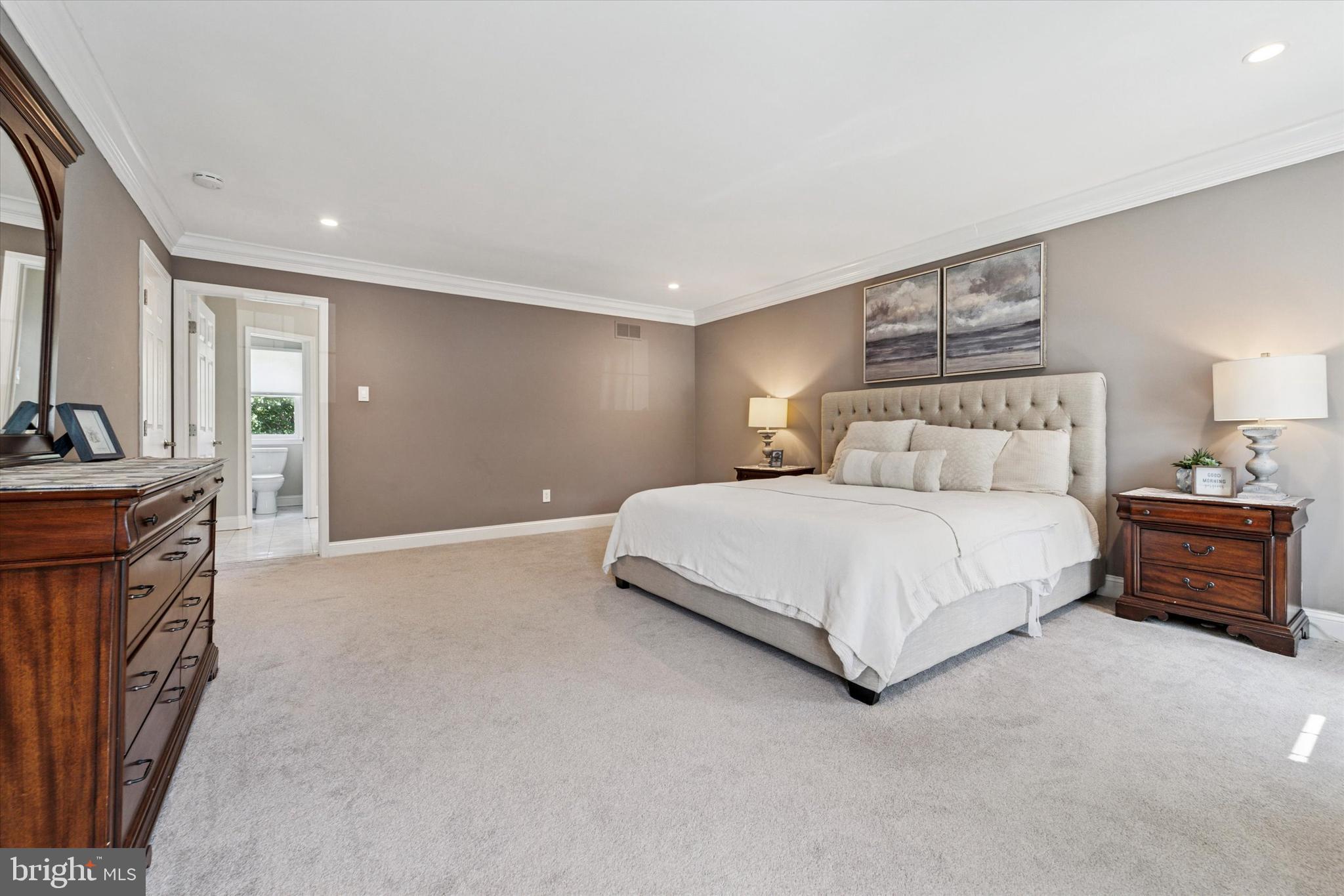 5 Stoney End Road Broomall, PA 19008 - Photo 27 of 48 a bedroom with a bed and a chandelier