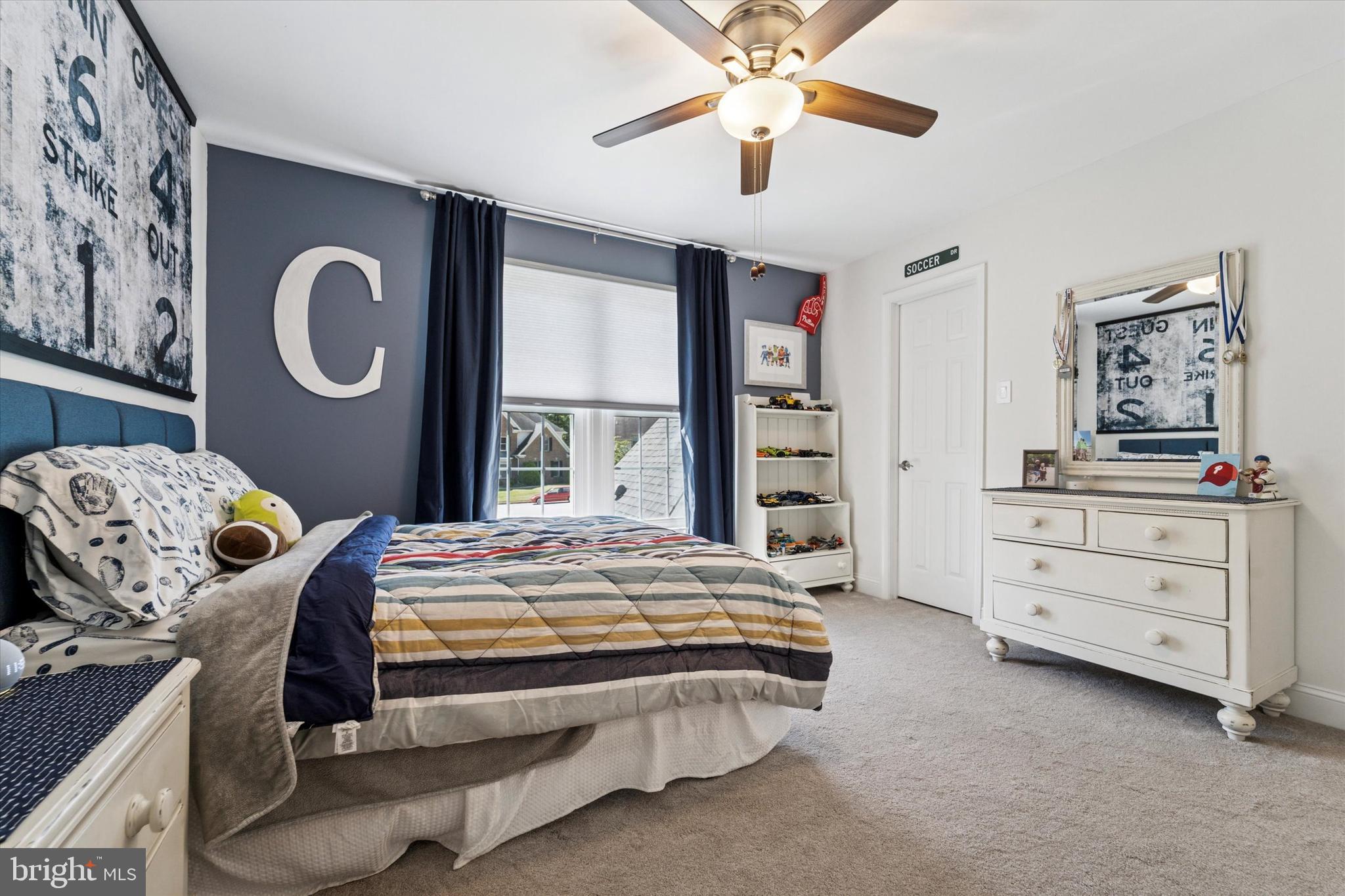 5 Stoney End Road Broomall, PA 19008 - Photo 37 of 48 a bedroom with a bed and a chandelier