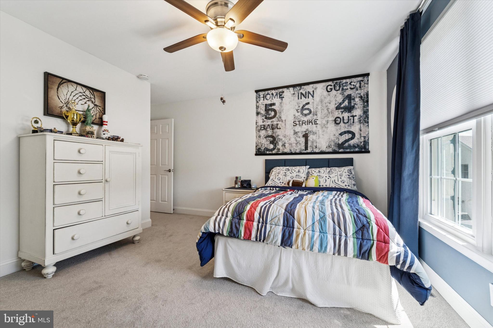 5 Stoney End Road Broomall, PA 19008 - Photo 39 of 48 a bed room with a bed and a painting on the wall