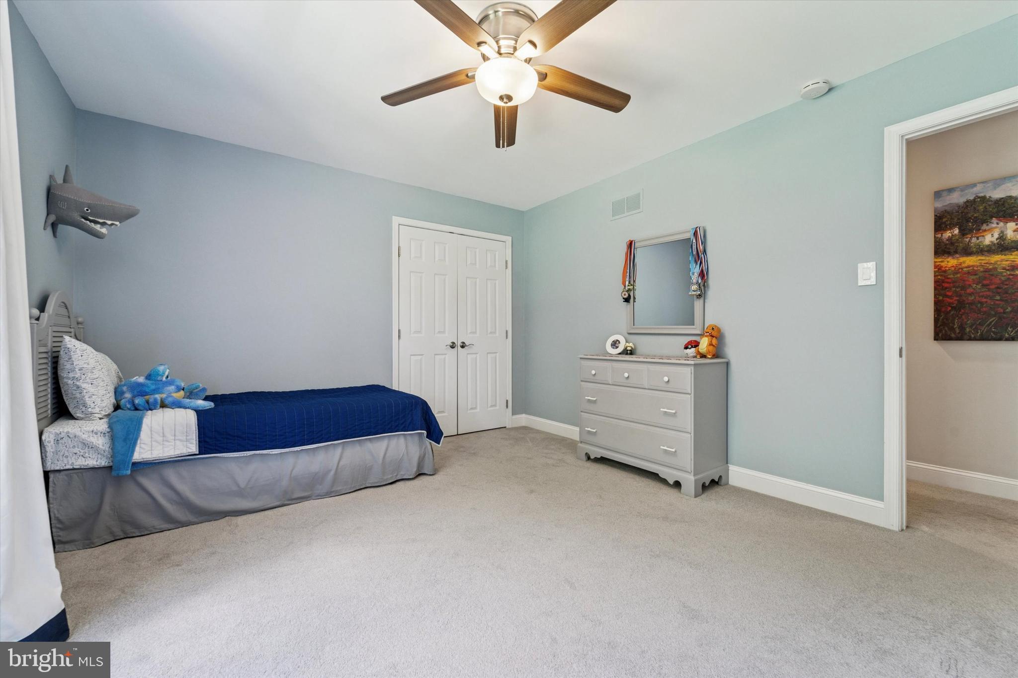 5 Stoney End Road Broomall, PA 19008 - Photo 41 of 48 a spacious bedroom with a bed and a chandelier