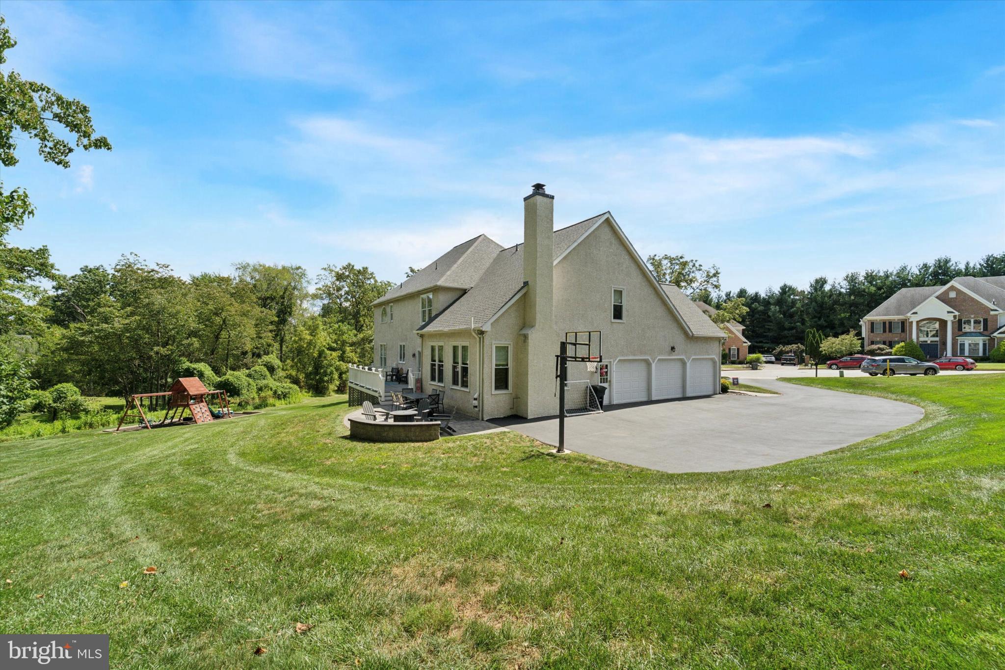 5 Stoney End Road Broomall, PA 19008 - Photo 48 of 48 a front view of a house with a yard and garage
