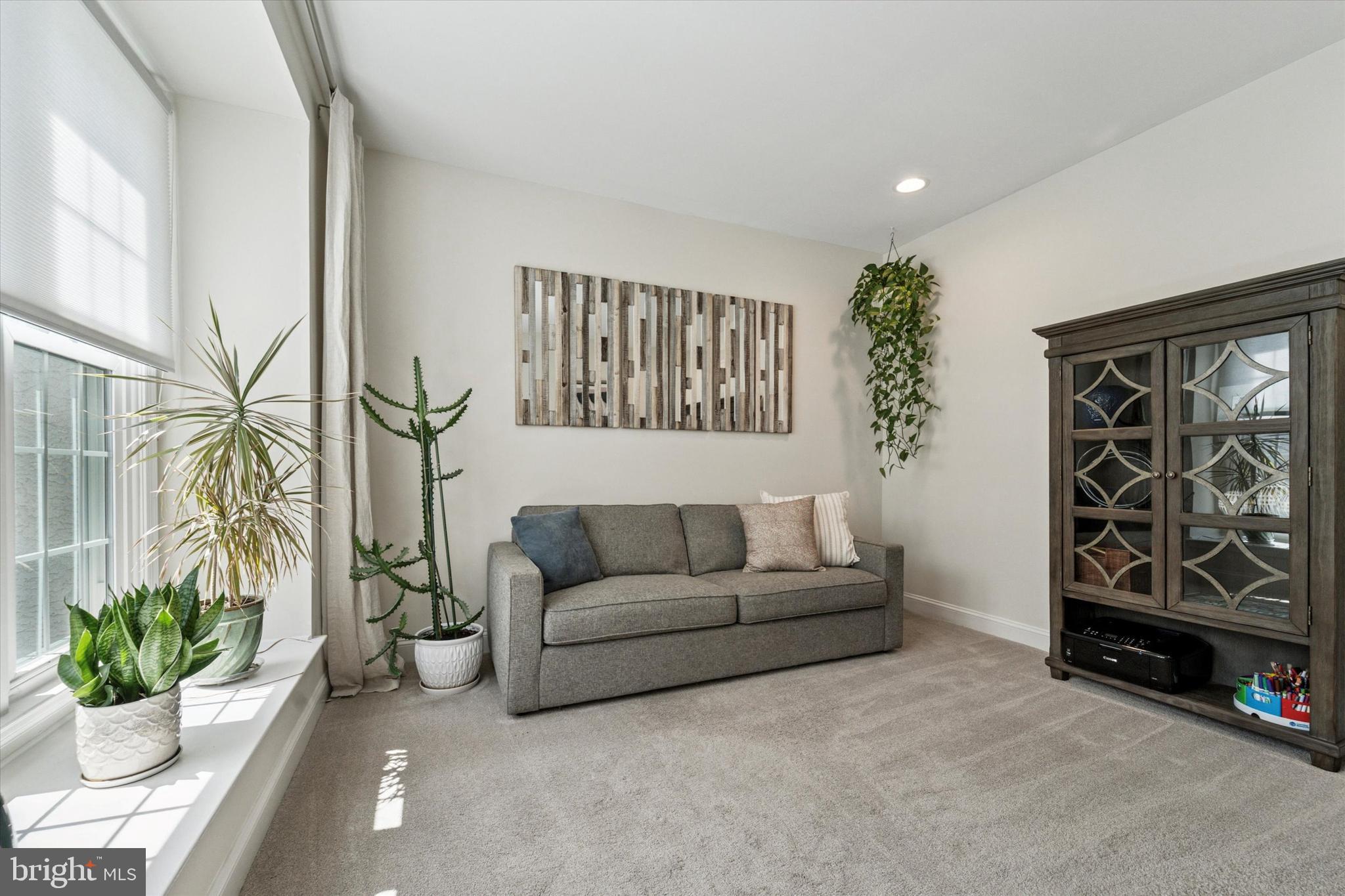 5 Stoney End Road Broomall, PA 19008 - Photo 7 of 48 a living room with furniture and a potted plant