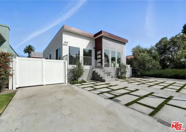 a view of a house with snow on the floor and a lot of windows