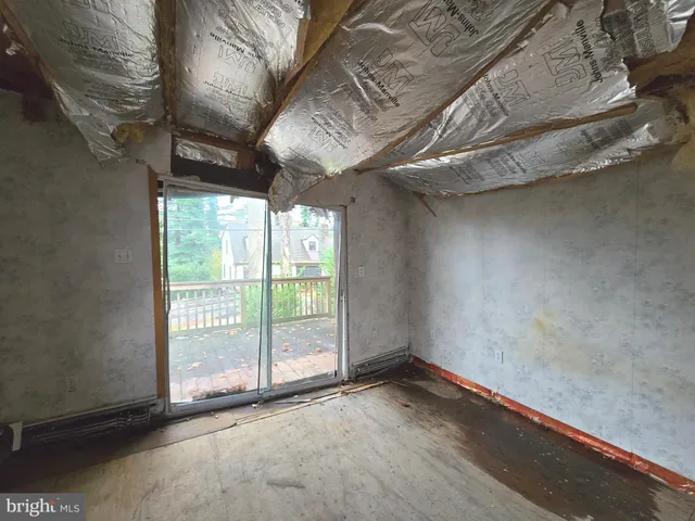 a view of empty room with windows