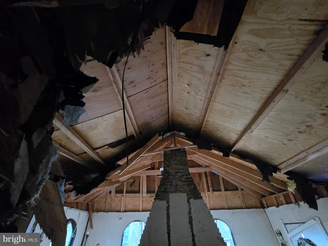 a view of a room with wooden walls