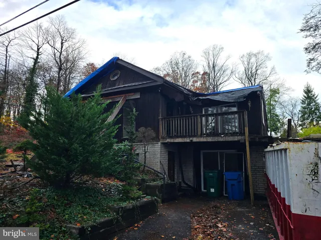 a front view of house with pathway and yard