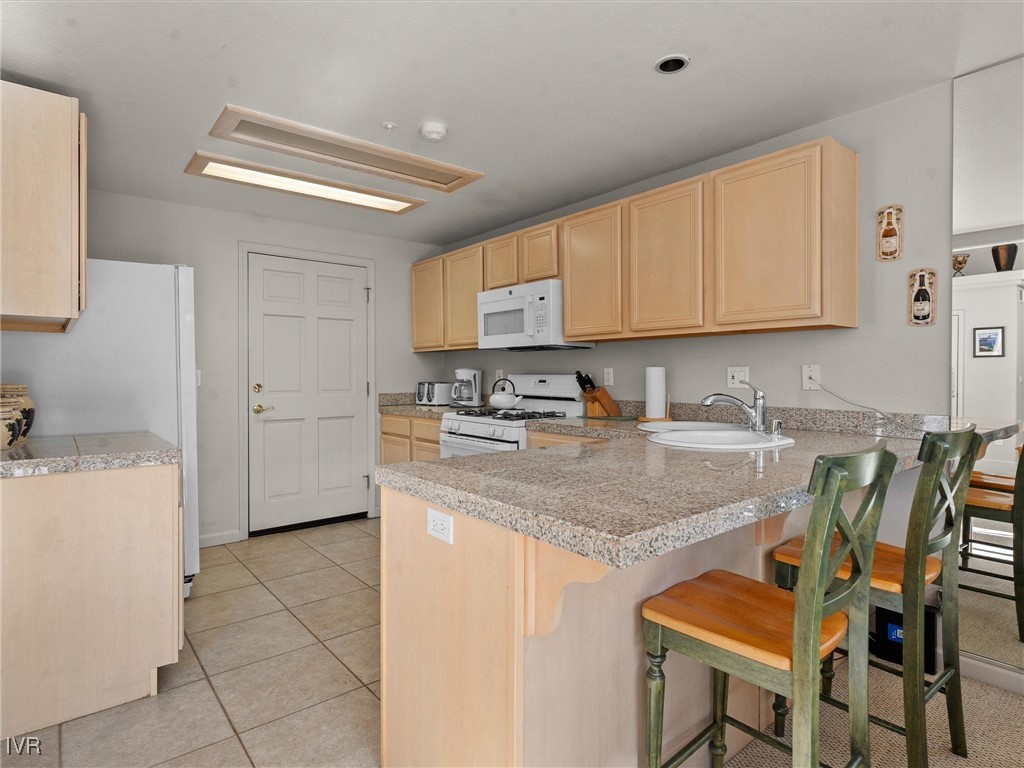 400 Fairview Boulevard, Unit 173 Incline Village, NV 89451 - Photo 10 of 34 a kitchen with a sink cabinets and window