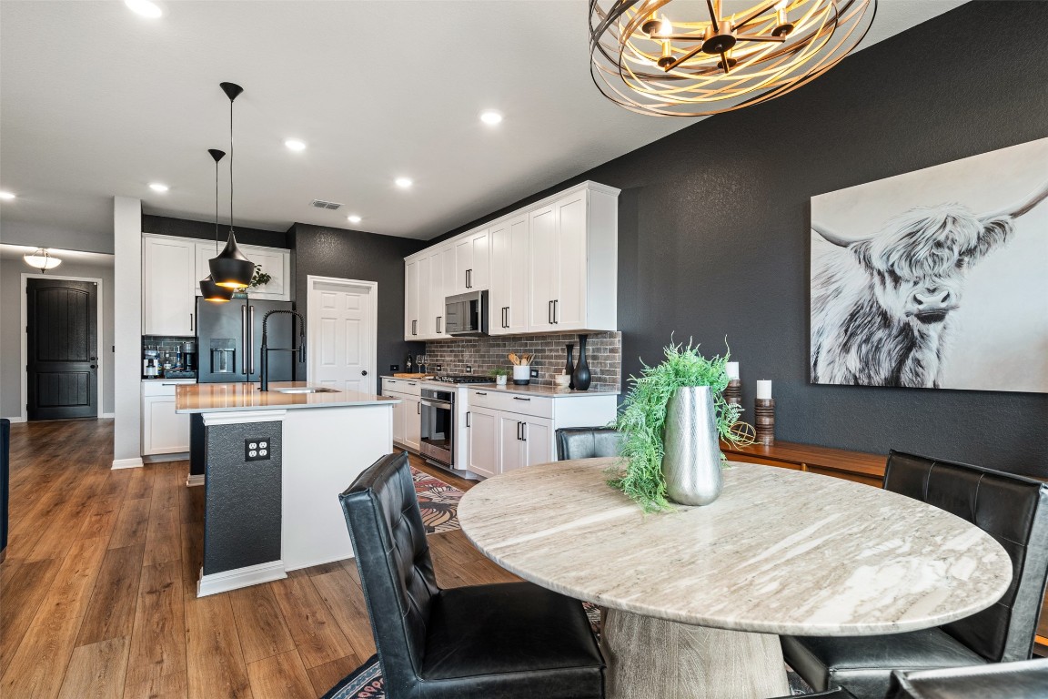 1009 Dog Iron Street Georgetown, TX 78633 - Photo 12 of 39 a kitchen with sink and refrigerator