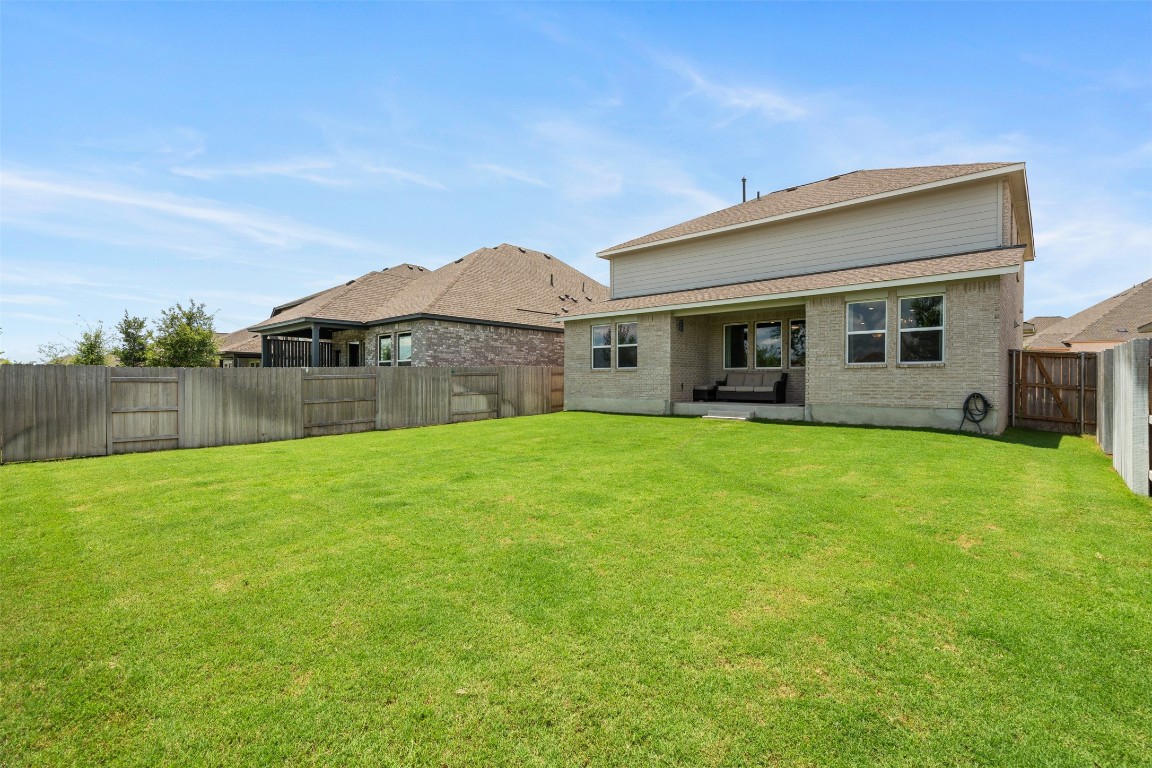 1009 Dog Iron Street Georgetown, TX 78633 - Photo 23 of 39 a front view of house with yard and green space