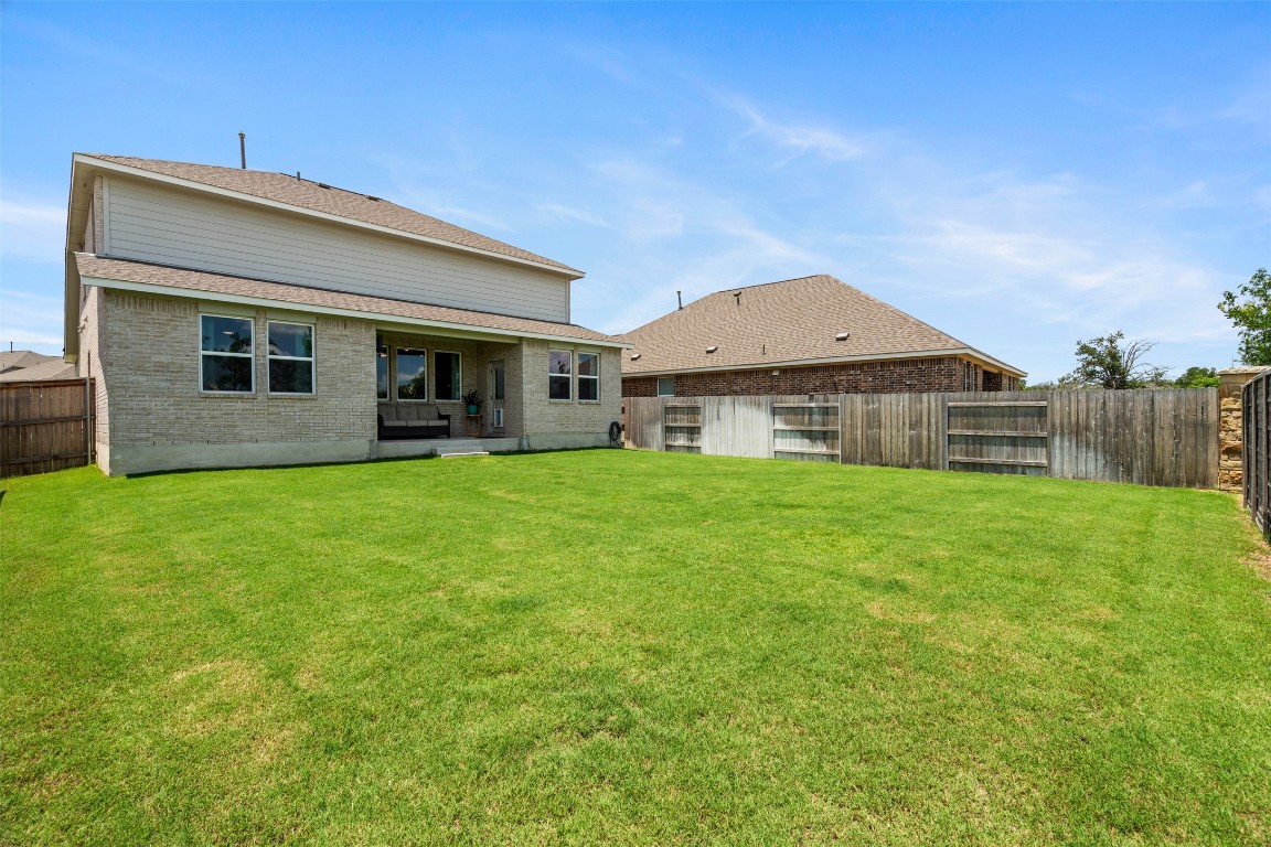 1009 Dog Iron Street Georgetown, TX 78633 - Photo 25 of 39 a front view of house with a garden