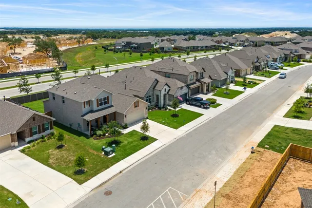 a workspace with furniture wooden floor and a window