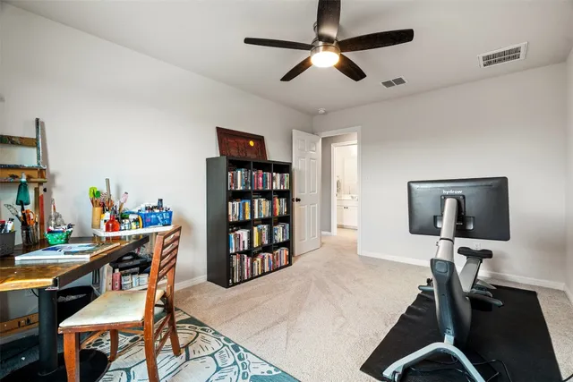 a spacious bedroom with a bed and a large window