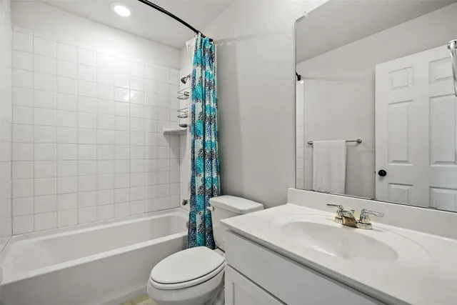 a en suite bathroom with a sink and a mirror
