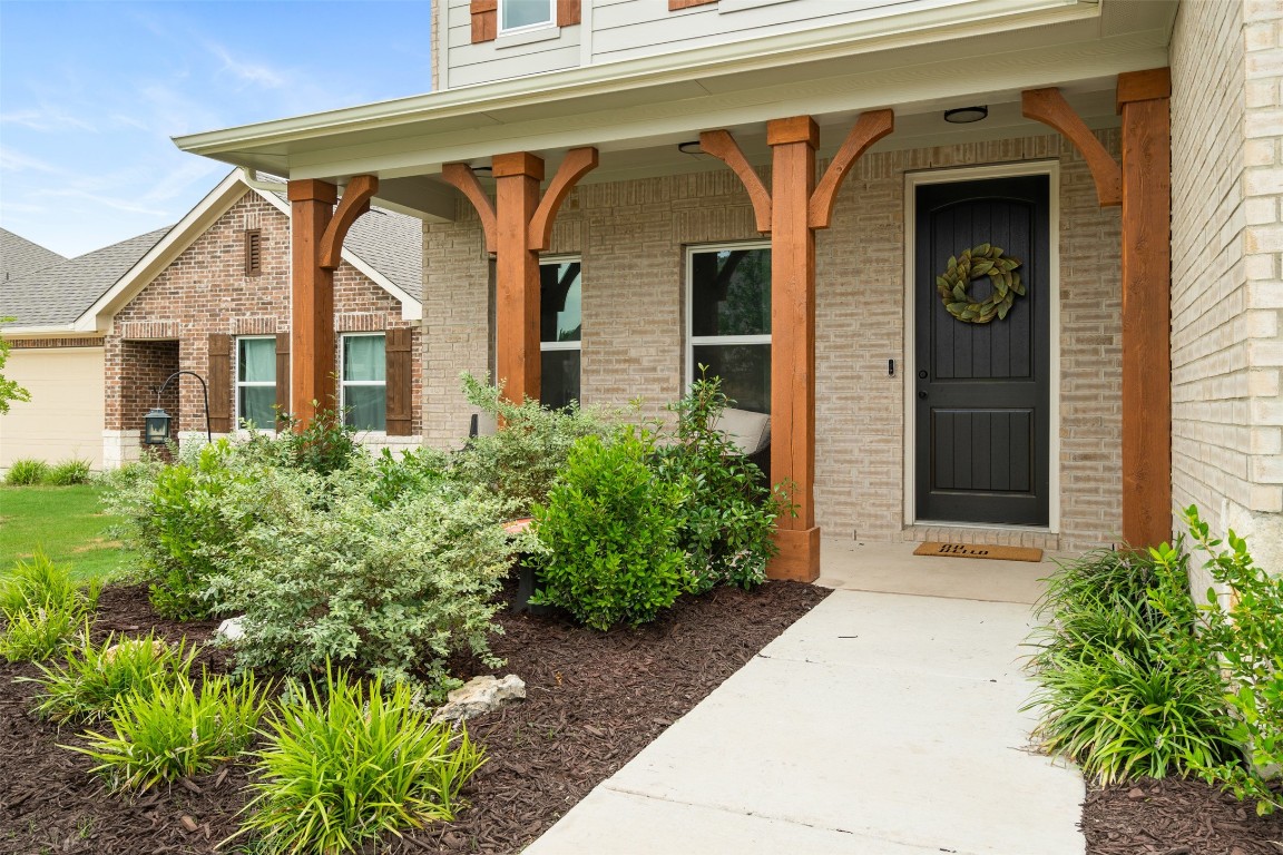1009 Dog Iron Street Georgetown, TX 78633 - Photo 4 of 39 a front view of a house with garden