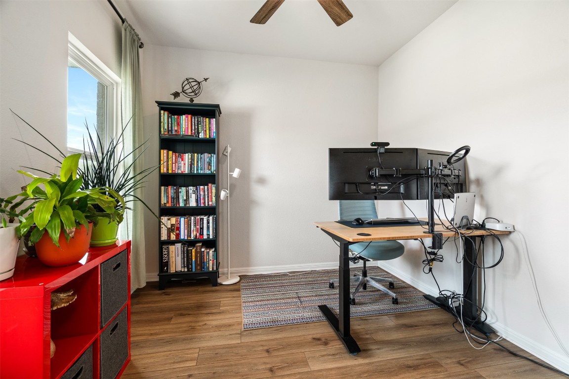 1009 Dog Iron Street Georgetown, TX 78633 - Photo 5 of 39 a living room with furniture and a book shelf