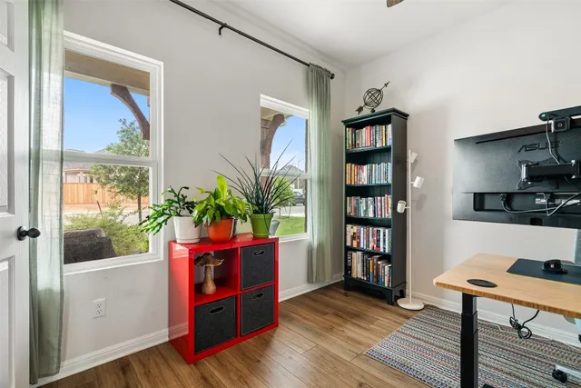 a room with furniture and a book shelf