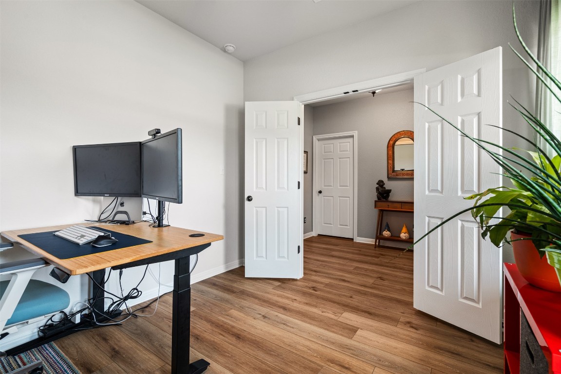 1009 Dog Iron Street Georgetown, TX 78633 - Photo 9 of 39 a view of a workspace with furniture and wooden floor