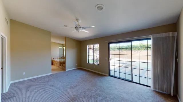 a view of empty room with a fireplace
