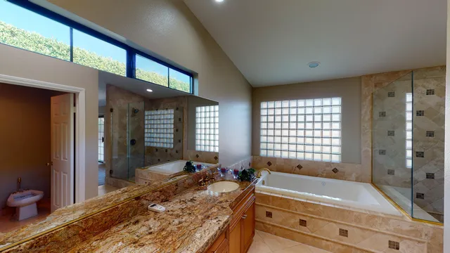 a bathroom with a bathtub and shower