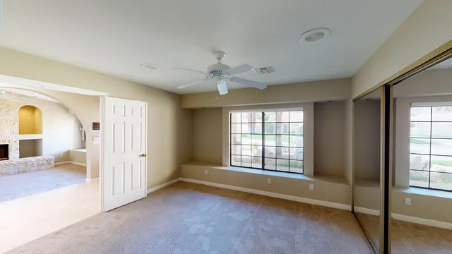 a view of an empty room with a window