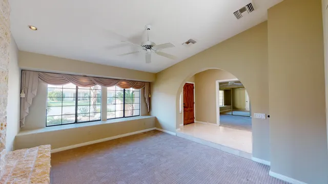 a view of entryway and hall with a large window