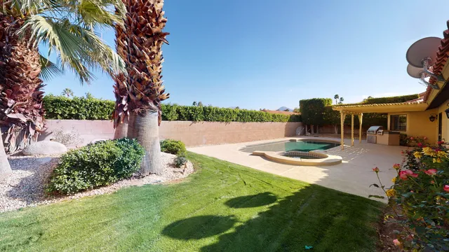 a view of swimming pool from a lounge chair