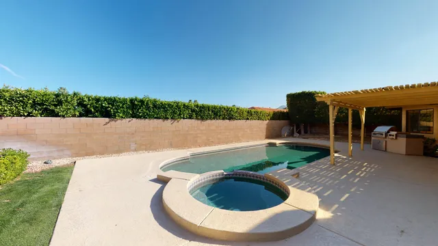a view of a patio with couches table and chairs and potted plants