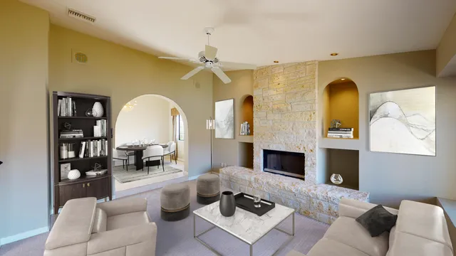 a living room with furniture fireplace and a fireplace